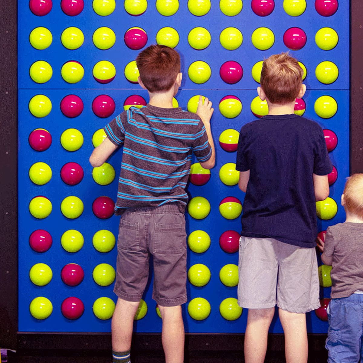 Three kids flipping the balls on the Spinfinity Wall by LiteZilla