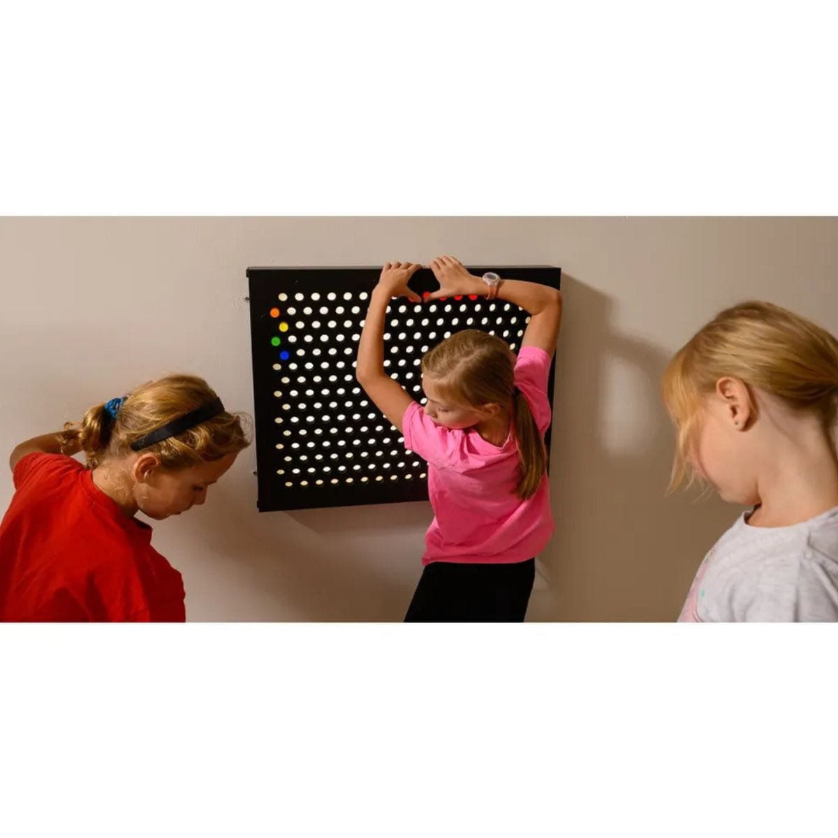 Three kids playing with Rod Wall Sensory Light Wall Panel