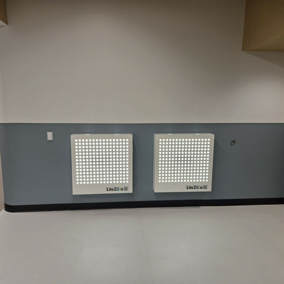Two (2) 32 inch by 32 inch LiteZilla Light Walls next to each other on the wall