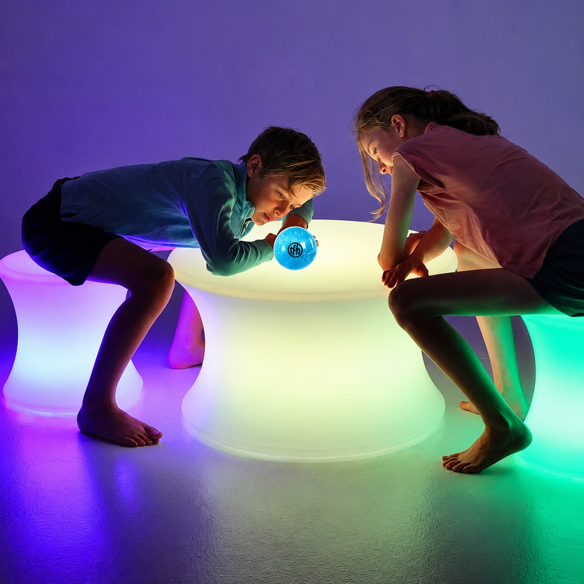Two kids sitting on LED Sensory Stools.jpg