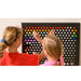 Two kids making a design on the Rod Wall Sensory Light Wall Panel