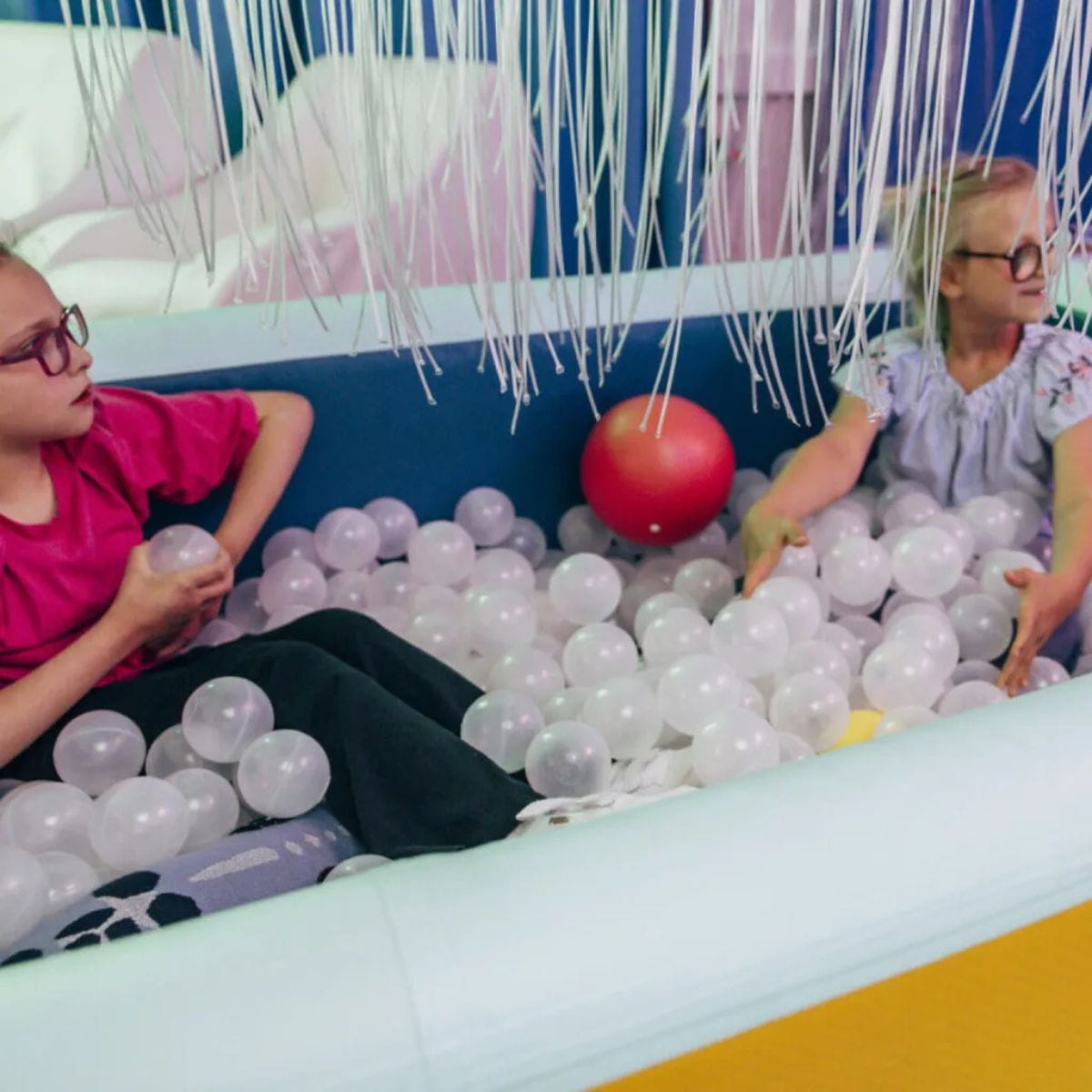 Two kids playing in the TFH Inflatable Ball Pit Pool