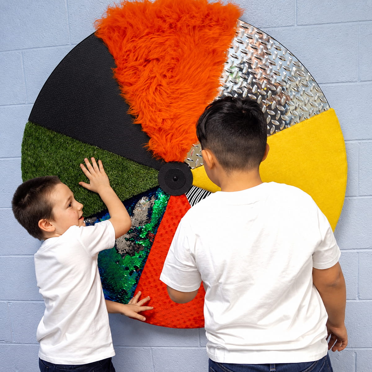 Two kids playing with the Sensory Texture Wheel