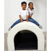 Two kids smiling on top of the Fiber Optic Tranquility Sensory Tunnel