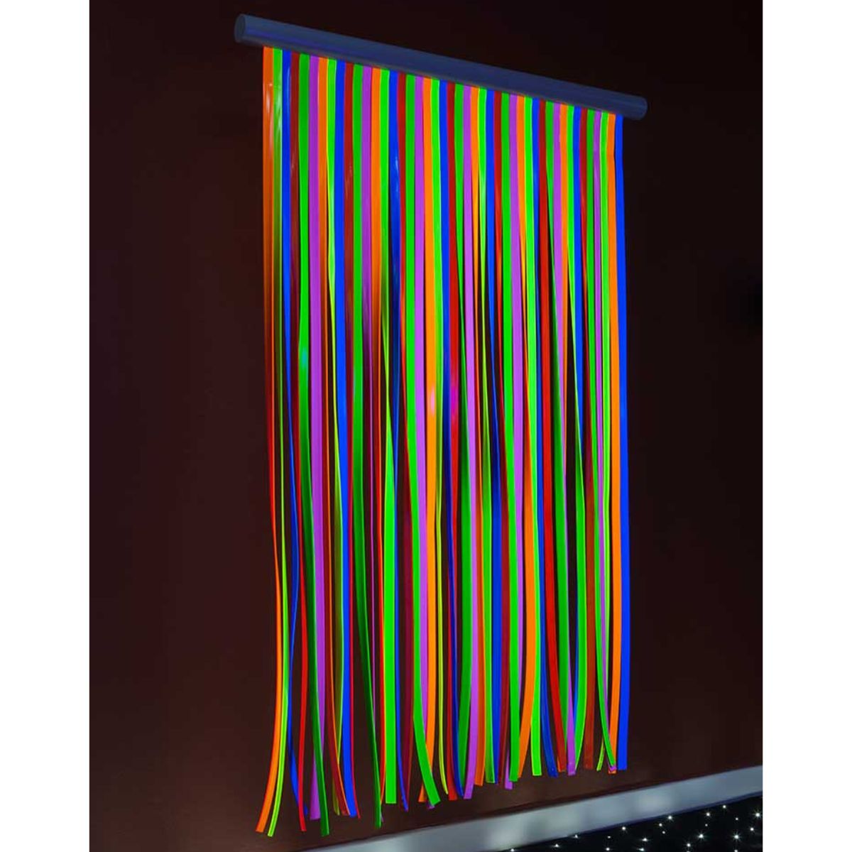UFOL Ultraviolet Sensory Waterfall against the wall with bright colors
