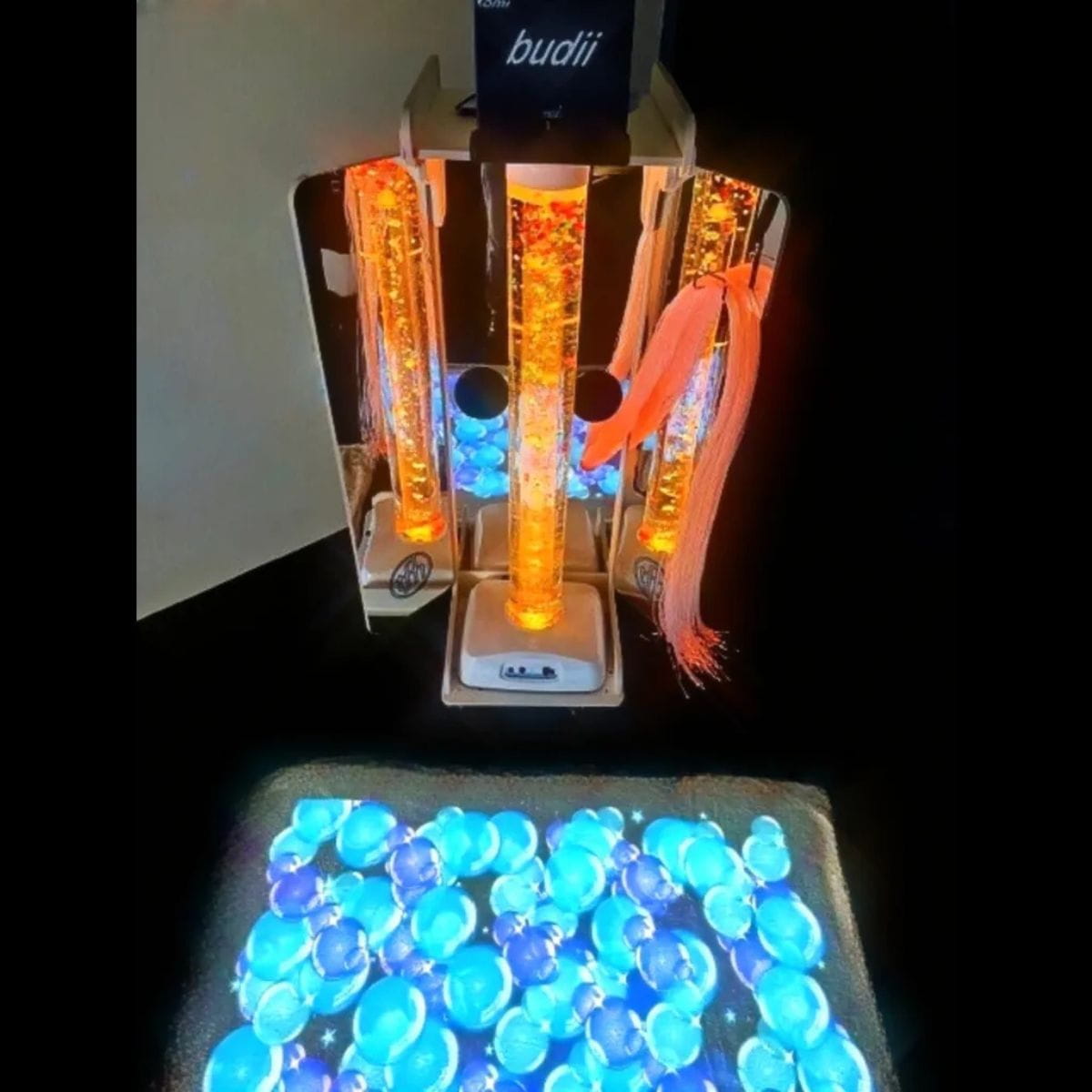 Vecta Budii Mobile Sensory Cart with bubbles image on floor and orange bubble tube