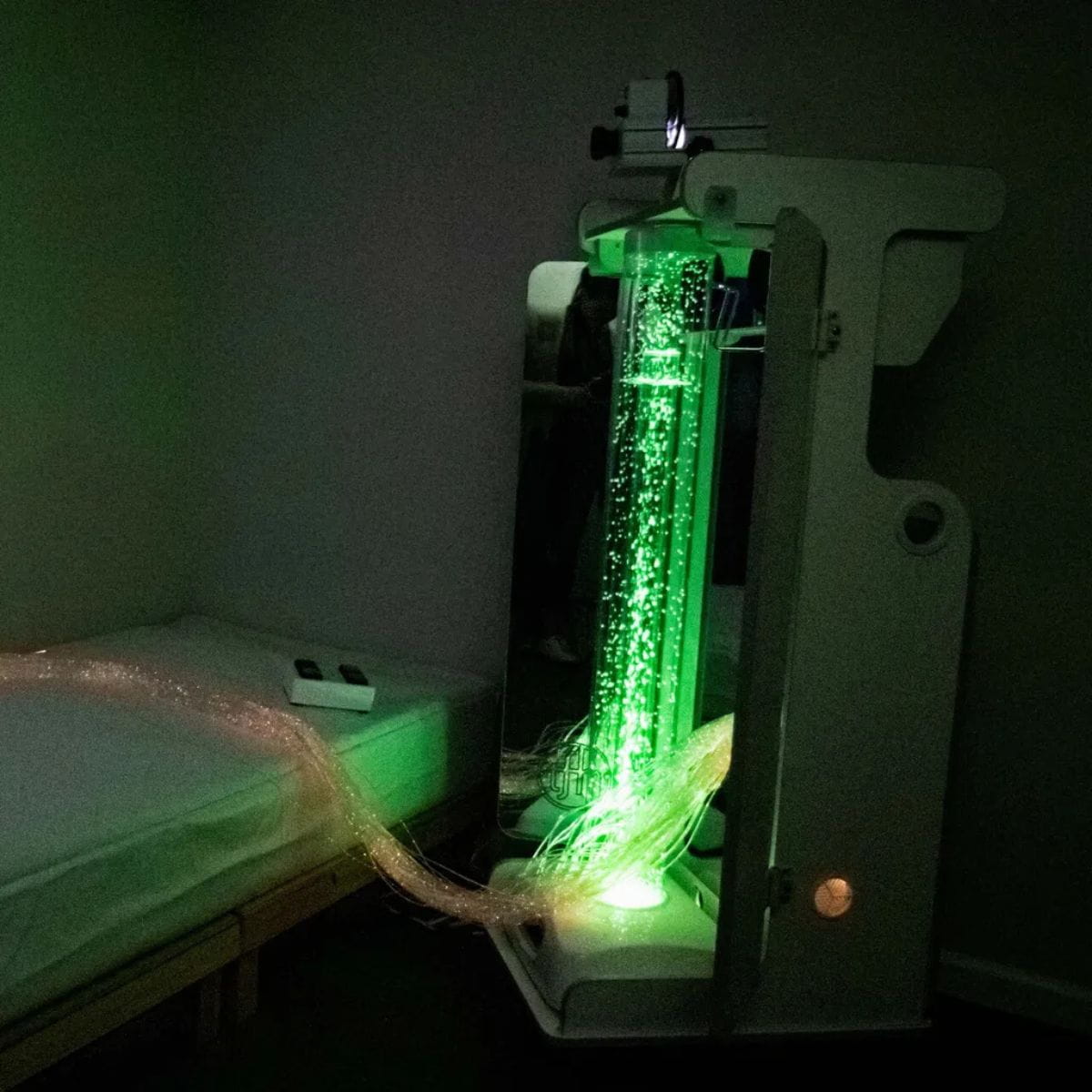 Vecta Delight Mobile Sensory Station next to bed in green