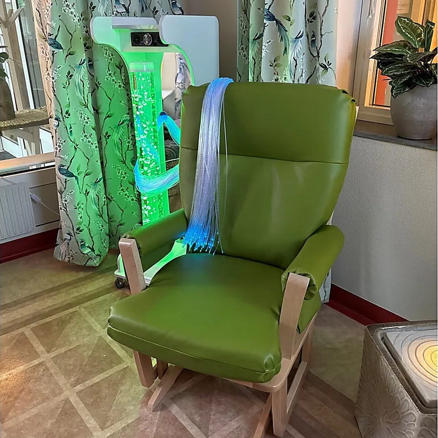 Vecta Jr Mobile Sensory Cart next to a chair