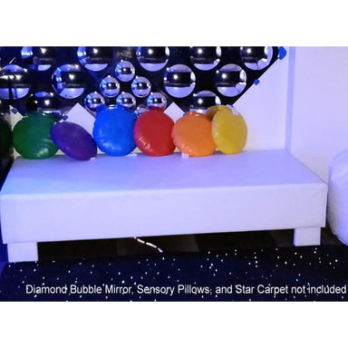 Vibro-Acoustic Sensory Platform Bench with colored pillows on it