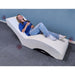 Vibro Acoustic Lounge Chair with person laying on it enjoying the vibration the 