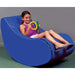 Vibroacoustic Jr Therapy Chair with girl sitting in it playing with two sensory toys
