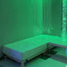 Vibroacoustic Waterbed next to bubble tube and sensory lights in green