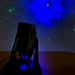 View of LED Laser Star Projector light show on wall