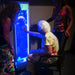 Woman in wheelchair touching the Sensory Bubble Wall Panel