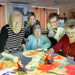 Women painting the image on a table from the omiVista Mobii Interactive Projector