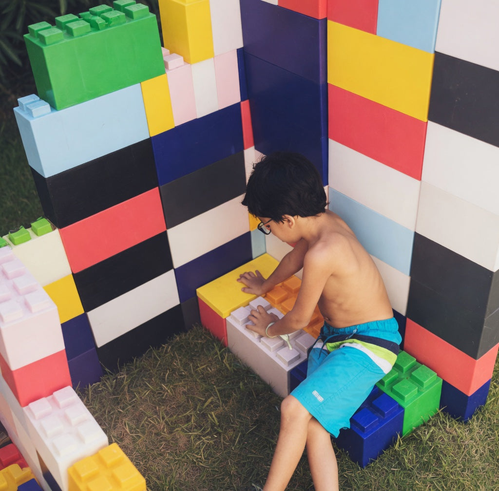 a_child_playing_with_giant_legos