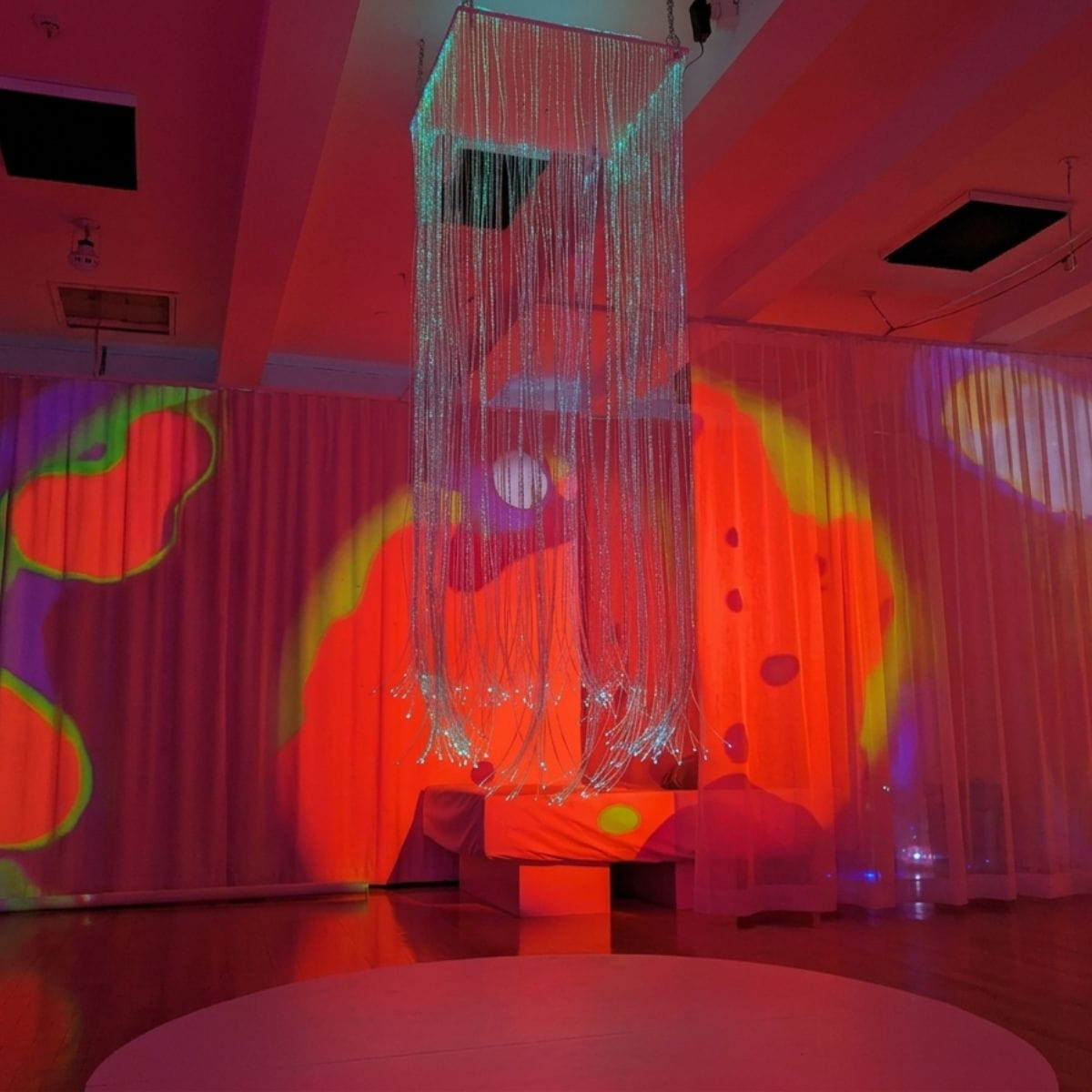 fiber optic sensory light Curtain hanging from the ceiling in an auditorium