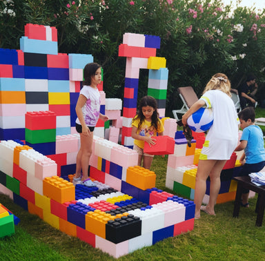 life_size_legos_with_3_kids_and_1_adult_playing