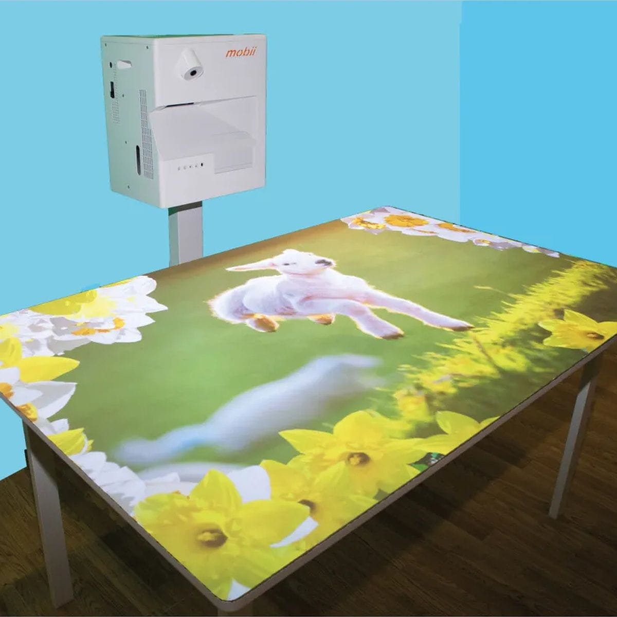 omiVista Mobii Interactive Projector with sheep image on table