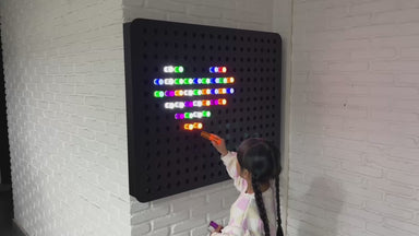 PixelPop Interactive Sensory Light Wall Panel with girl making a heart